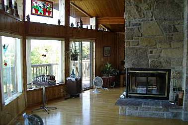 The living room and 3-sided fireplace, as purchased